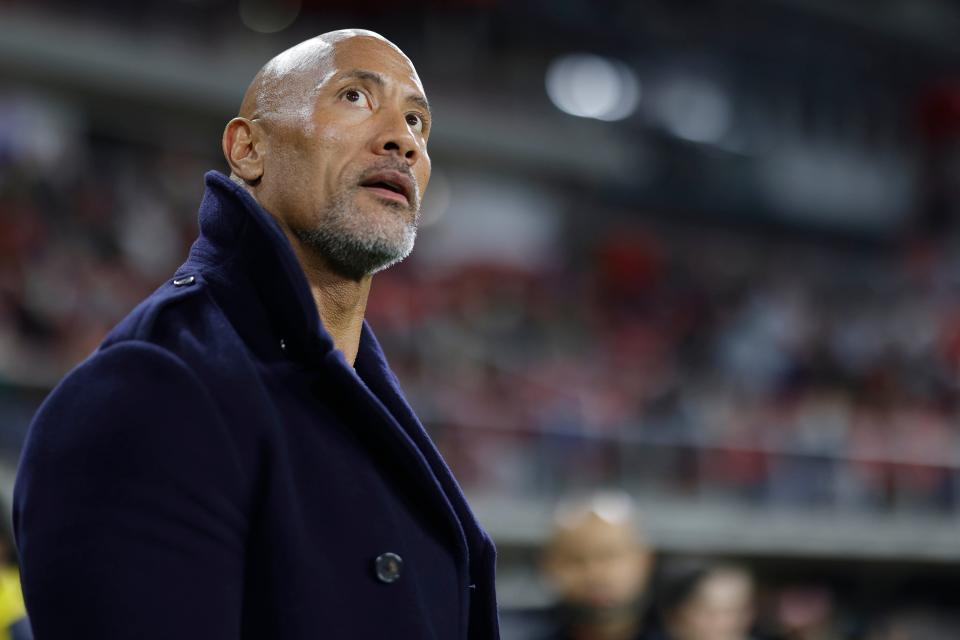 Feb 19, 2023; Washington, DC, USA; XFL co-owner Dwayne Johnson watches the game between the D.C. Defenders and the Seattle Sea Dragons from the sideline during the second quarter at Audi Field.