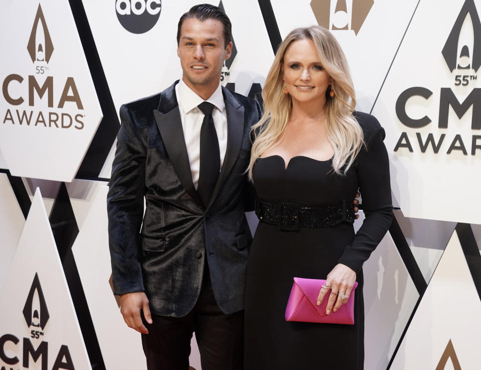 Miranda Lambert, right, and Brendan McLoughlin arrive at the 55th annual CMA Awards on Wednesday, Nov. 10, 2021, at the Bridgestone Arena in Nashville, Tenn. (AP Photo/Ed Rode)