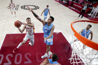 Spain's Sergio Rodriguez (6) drives to the basket against Argentina's Gabriel Deck (14) during a men's basketball preliminary round game at the 2020 Summer Olympics, Thursday, July 29, 2021, in Saitama, Japan. (AP Photo/Eric Gay)