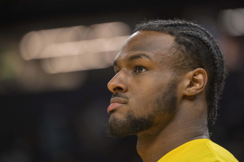 Los Angeles Lakers guard Bronny James watches warmup action before an NBA summer league basketball game against Golden State Warriors in San Francisco , Sunday, July 7, 2024. (AP Photo/Nic Coury)