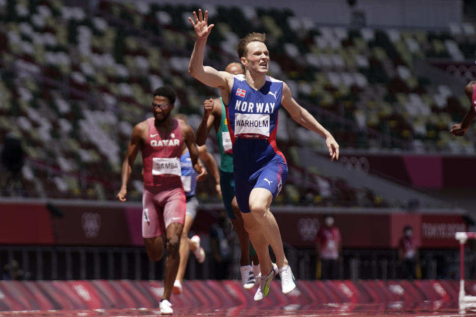 Karsten Warholm, of Norway, wins the men's 400-meter hurdles final at the 2020 Summer Olympics, Tuesday, Aug. 3, 2021, in Tokyo. (AP Photo/Petr David Josek)