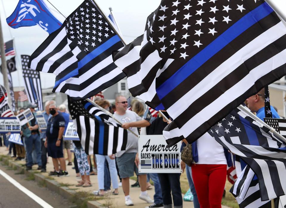 The thin blue line flag is seen by some as a refutation of the Black Lives Matter movement, as supportive of systemic racism in the criminal justice system, and as emblematic of the authoritarian leanings of many on the right, writes Justin Glawe.