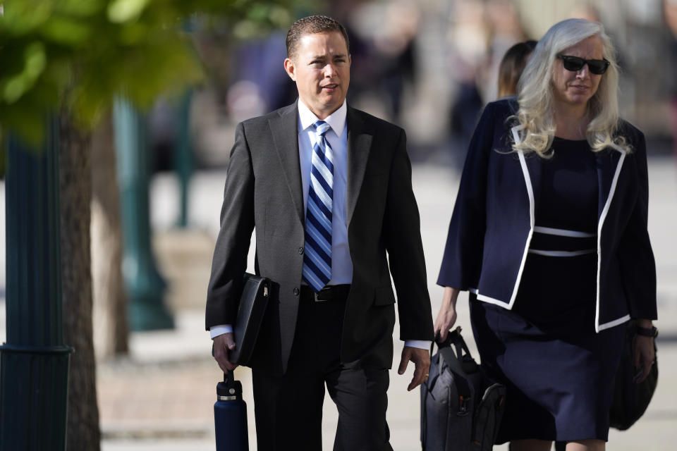 Michael J. Allen, left, district attorney for Colorado's Fourth Judicial District, heads into a hearing for the suspect in a mass shooting at a gay nightclub Monday, June 26, 2023, in Colorado Springs, Colo. The suspect is expected to plead guilty in the attack that left five people dead and wounded 17 just before Thanksgiving Day 2022 at the longtime sanctuary for the LGBTQ+ community in this mostly conservative city. (AP Photo/David Zalubowski)