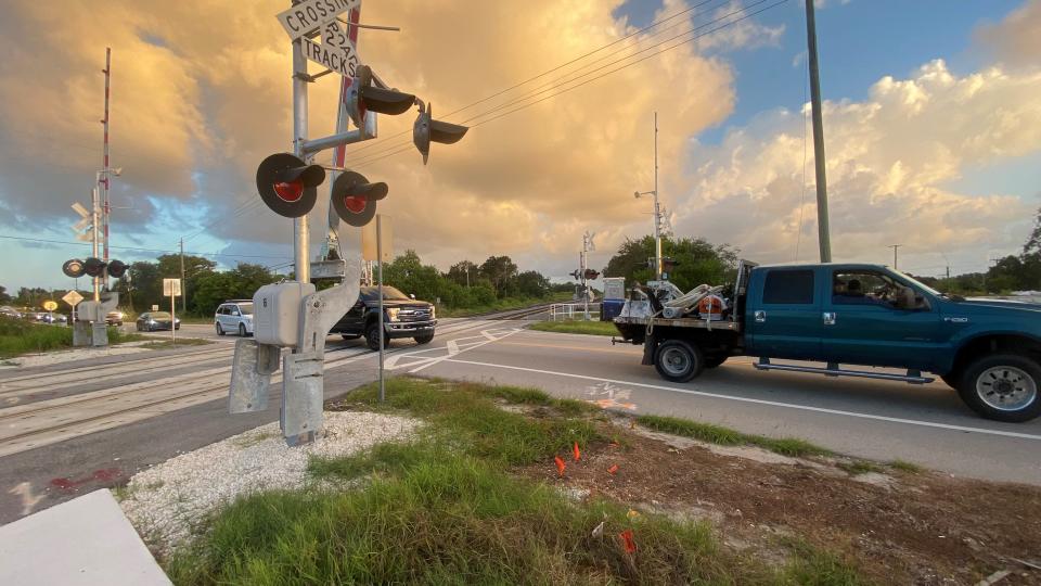 The sun tries to peek through clouds in Sebastian at U.S. 1 and County Road 512 after the first Brightline train passed through in under 30 seconds.