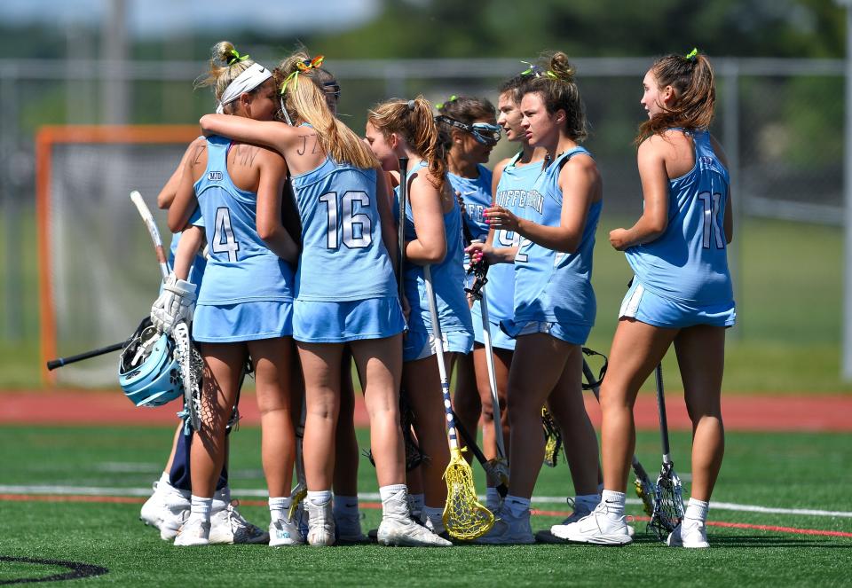 Suffern players huddle after their loss to Northport in a Class A semifinal at the NYSPHSAA Girls Lacrosse Championships in Cortland, N.Y., Friday, June 10, 2022.
