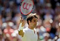 Roger Federer of Switzerland celebrates after winning his match against Samuel Groth of Australia at the Wimbledon Tennis Championships in London, July 4, 2015. REUTERS/Henry Browne
