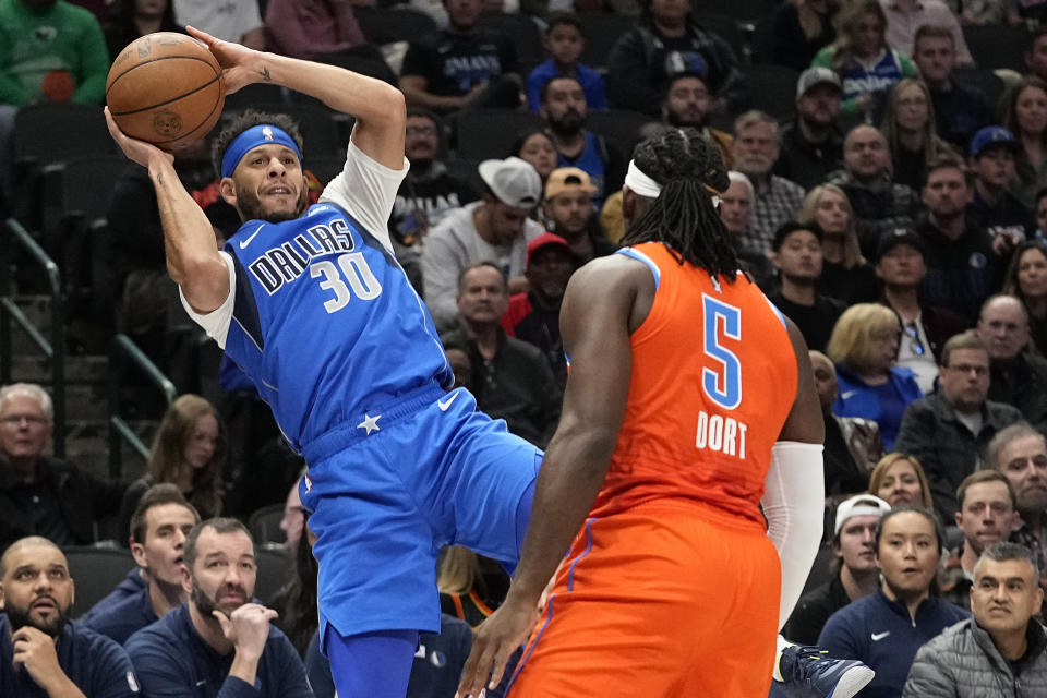 Dallas Mavericks guard Seth Curry (30) looks to shoot against Oklahoma City Thunder guard Luguentz Dort (5) during the first half of an NBA basketball game in Dallas, Saturday, Dec. 2, 2023. (AP Photo/LM Otero)