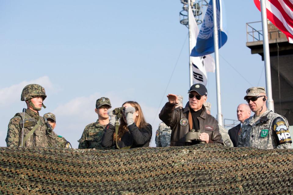 Vice President Joe Biden and granddaughter Finnegan Biden are briefed by Lieutenant Colonel Daniel Edwan, Commander of the United Nations Command Security Battalion, as they look out over the De Militarized Zone. December 7,&nbsp;2013.