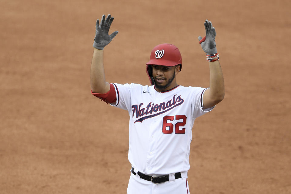 Washington Nationals' Luis Garcia reacts after he drove in two runs with his single during the sixth inning of a baseball game against the New York Mets, Sunday, Sept. 27, 2020, in Washington. (AP Photo/Nick Wass)