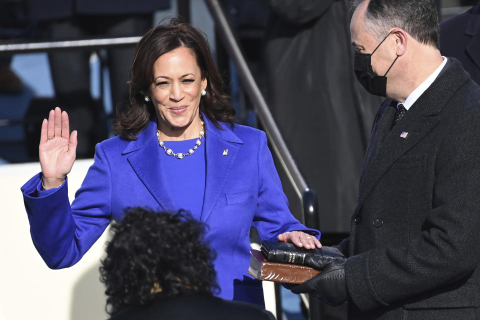 Kamala Harris is sworn in as vice president as her husband, Doug Emhoff, holds the Bible at the U.S. Capitol on Jan. 20, 2021. (Photo: Saul Loeb/Pool Photo via AP)