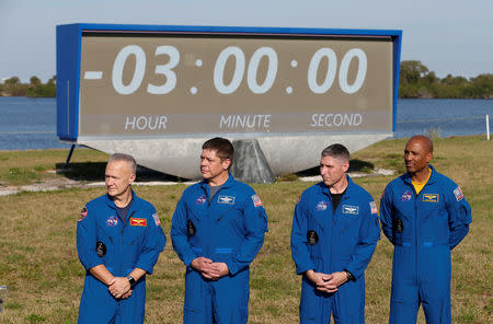 NASA commercial crew astronauts Doug Hurley, Bob Behnken, Mike Hopkins and Victor Glover speak to the media before the launch of a SpaceX Falcon 9 carrying the Crew Dragon spacecraft on an uncrewed test flight to the Internation Space Station from the Kennedy Space Center in Cape Canaveral, Florida, U.S. March 1, 2019. REUTERS/Joe Skipper