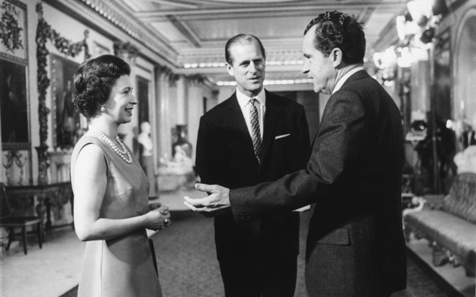 President Nixon speaks with the Queen and Prince Philip at Buckingham Palace - Bettmann