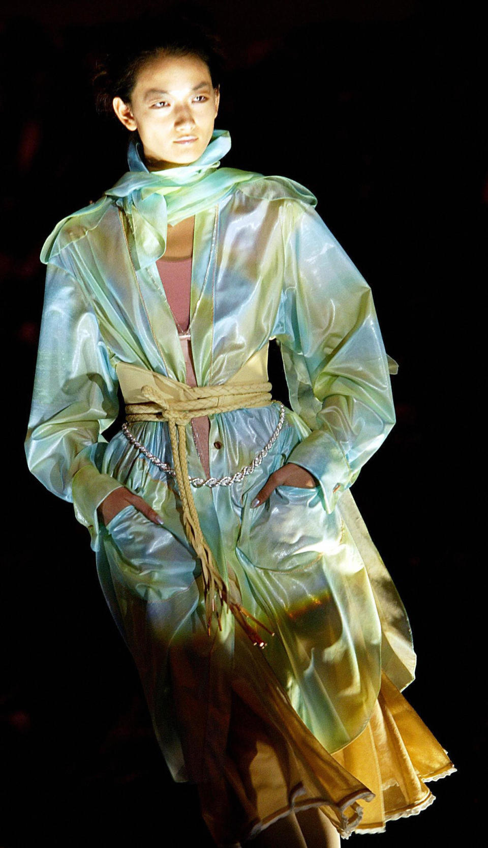 A model walks on the catwalk as she displays an outfit from Fendi's spring/summer collection, shown in Milan on Oct. 4, 2003.&nbsp;