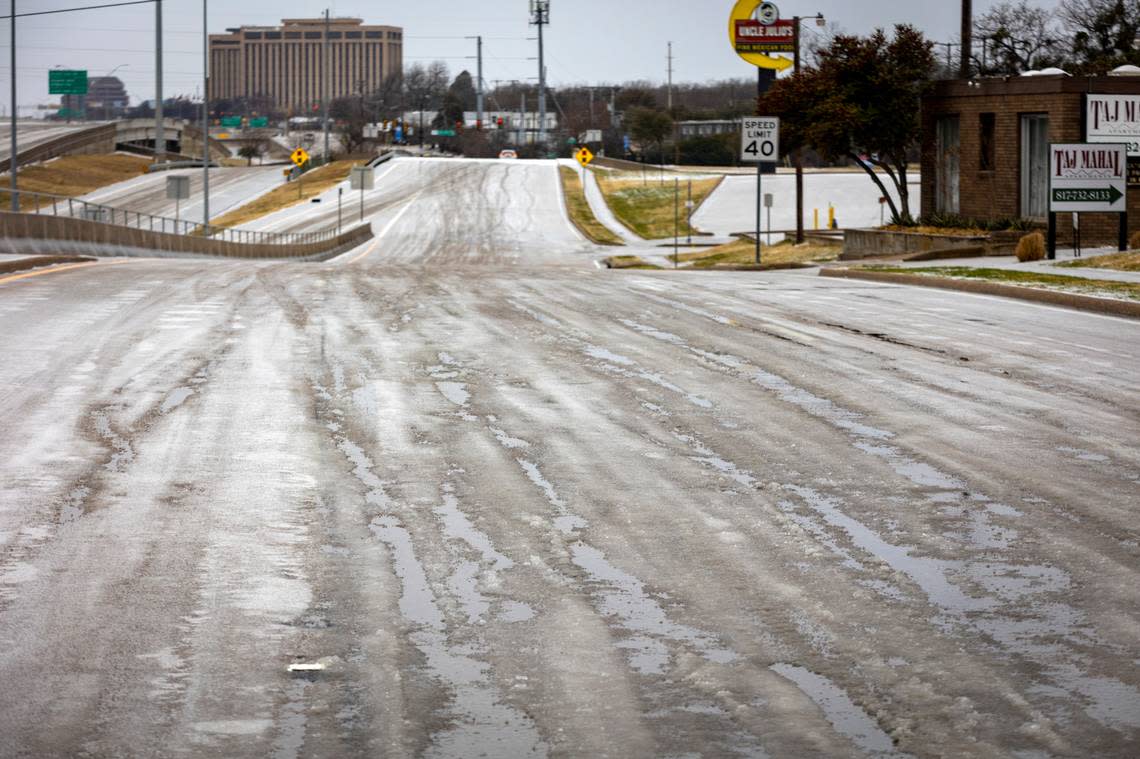 Puddles of ice and water mix on roads of Fort Worth on Wednesday, Feb. 1, 2023. Tarrant County is one of many in North Texas under an ice storm warning until 9 a.m. Thursday morning.