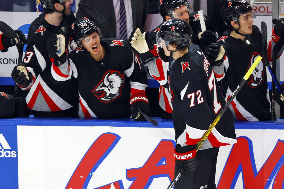 Buffalo Sabres center Tage Thompson (72) is congratulated at the bench after scoring a goal in the third period of an NHL hockey game against the Los Angeles Kings, Tuesday, Dec. 13, 2022, in Buffalo, N.Y. (AP Photo/Jeffrey T. Barnes)