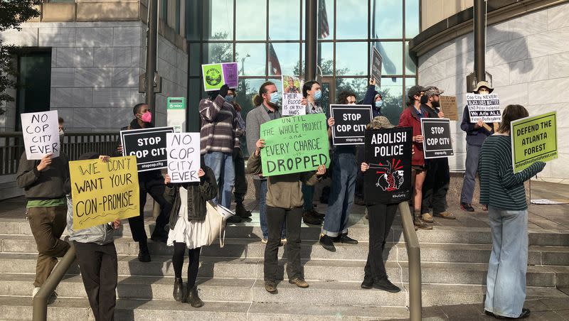 Demonstrators gather outside of Atlanta’s City Hall on Tuesday, Jan. 31, 2023, as local officials announce they are moving forward with plans to build the Atlanta Public Safety Training Center. The protesters have called for officials to abandon plans for the project which they derisively call Cop City.