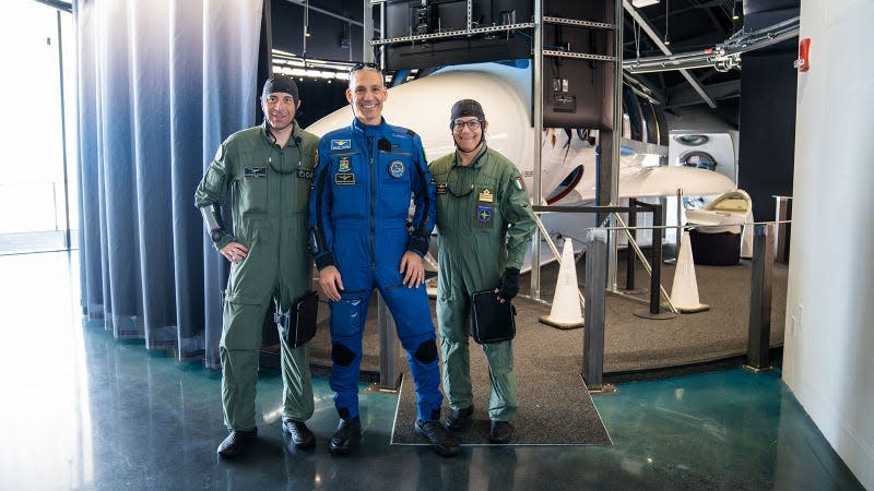 A photo of the three passengers that will fly with Virgin Galactic. 