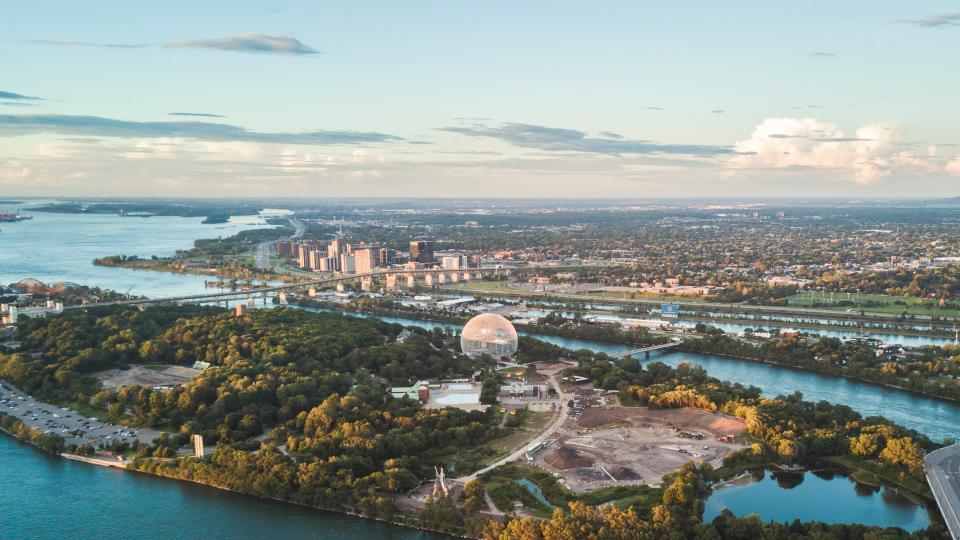 Sunset aerial view of Jean-Drapeau Island besides Montreal city