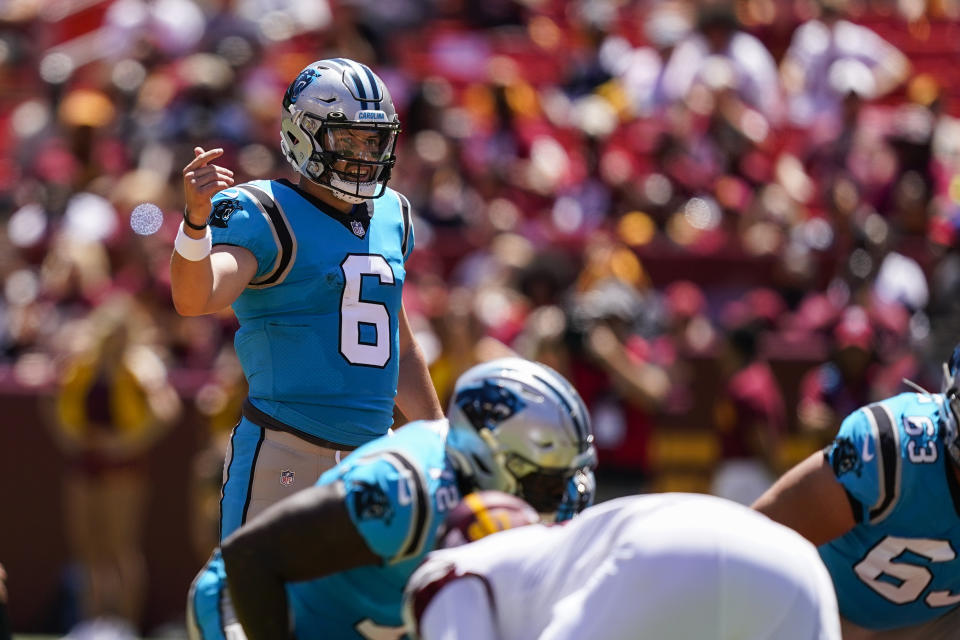 Carolina Panthers quarterback Baker Mayfield (6) directs his team during the first half an NFL preseason football game against the Washington Commanders, Saturday, Aug. 13, 2022, in Landover, Md. (AP Photo/Alex Brandon)