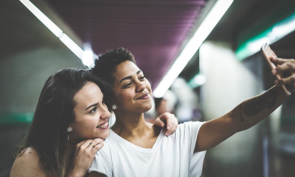 Lesbian Couple Taking a Selfie at Subway