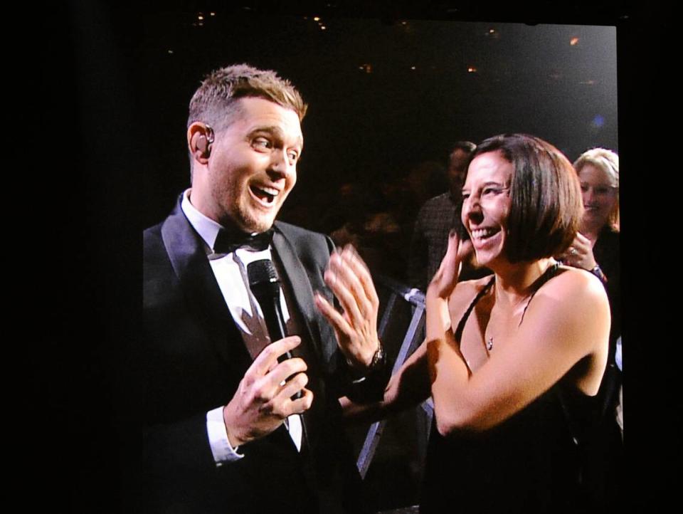 Michael Buble hobnobs with fans at the arena during a concert in October 2013.