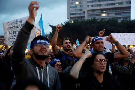 Demonstrators take part in a protest against Guatemala's President Jimmy Morales' decision to not renew the mandate of the U.N.-backed anti-graft commission, the International Commission Against Impunity (CICIG), in Guatemala City, Guatemala September 14, 2018. REUTERS/Luis Echeverria