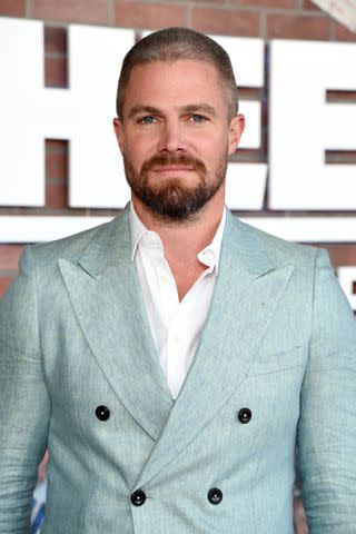 <p>Michael Kovac/Getty</p> Stephen Amell attends the premiere of the new STARZ series "Heels" on August 10, 2021 in Los Angeles