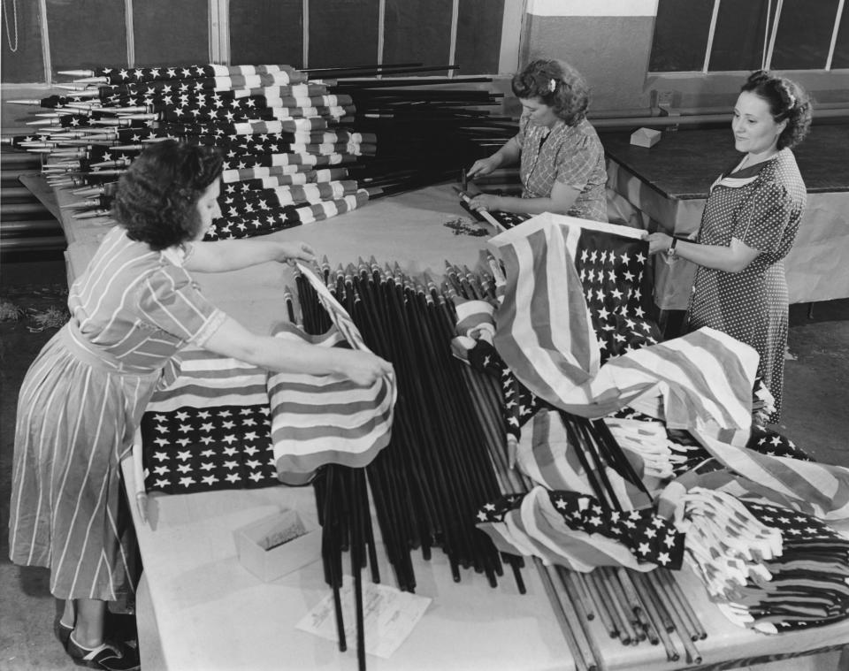 Three women making US flags in a factory, USA, circa 1945. (Photo by Frederic Lewis/Archive Photos/Getty Images)