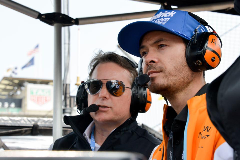 Jeff Gordon and Kyle Larson sit in the Arrow McLaren pit box Thursday, May 18, 2023, during the third day of practice for the 107th running of the Indianapolis 500 at Indianapolis Motor Speedway. 