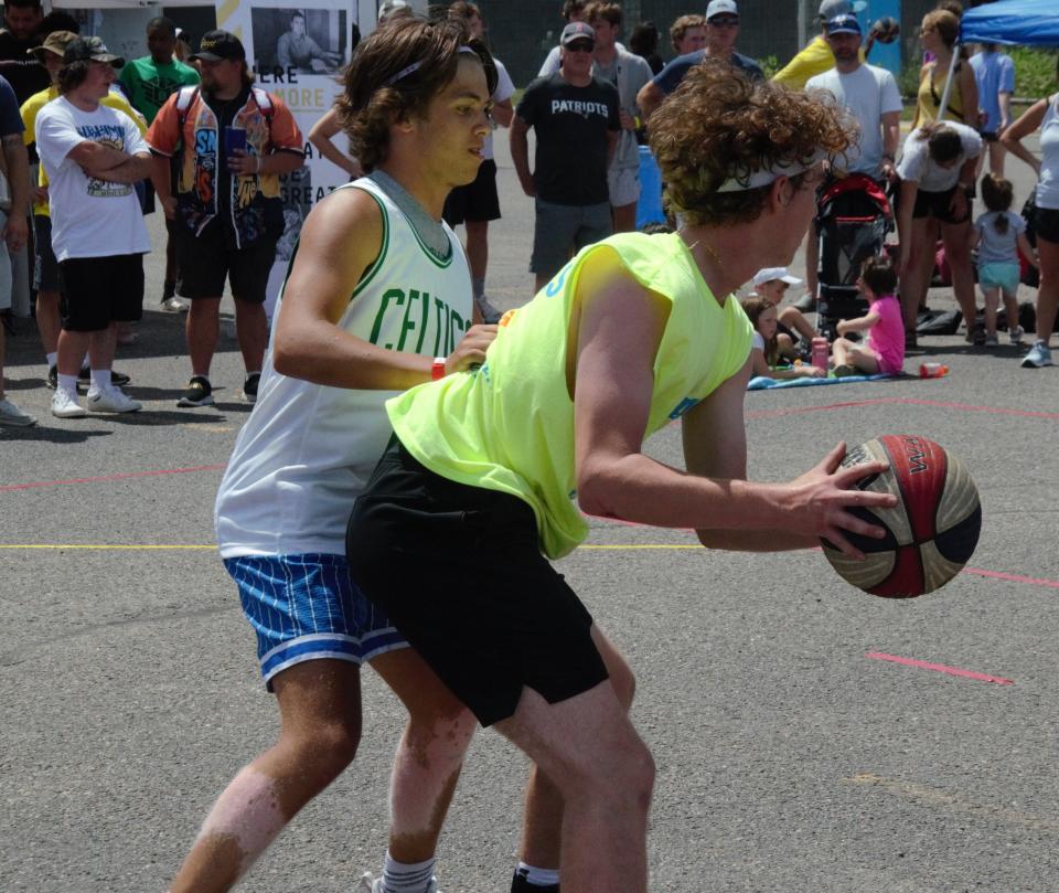 Gaylord's Luke Enders posts up against Gaylord St. Mary's Gavin Bebble during a matchup at the Gaylord Gus Macker on Saturday, June 25 at the Ostego County Sportsplex in Gaylord.