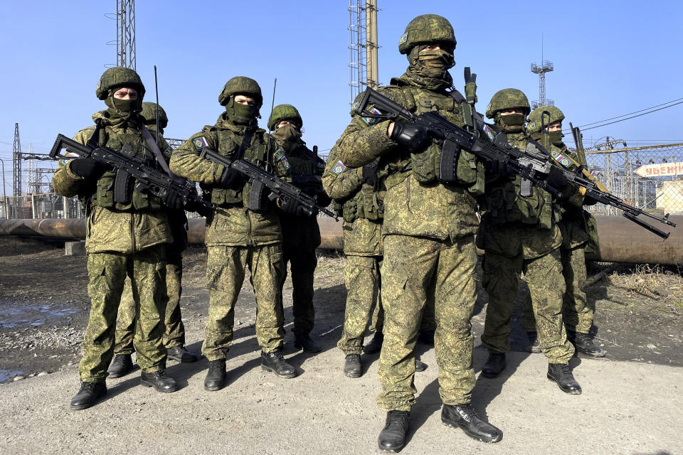 FILE - In this photo released by the Russian Defense Ministry Press Service, Russian peacekeepers of the Collective Security Treaty Organization guard an area in Kazakhstan, Wednesday, Jan. 12, 2022. To quell the violence, President Kassym-Jomart Tokayev requested help from a Russia-led security alliance, the Collective Security Treaty Organization. The bloc of six former Soviet states sent more than 2,000 troops. (Russian Defense Ministry Press Service via AP, File)