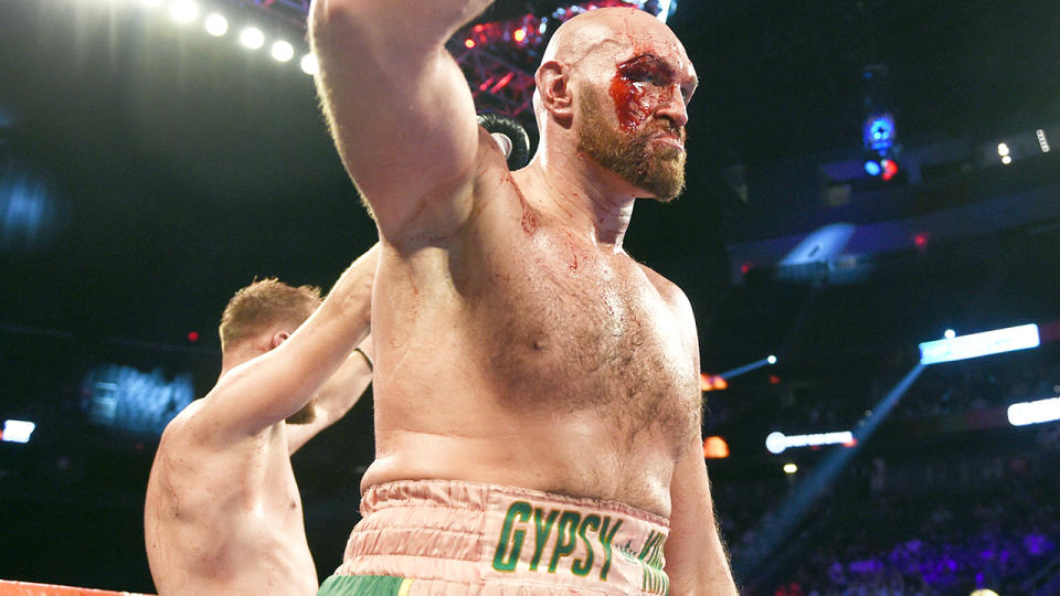 A bloodied Tyson Fury, pictured after defeating Otto Wallin, wants a rematch with Deontay Wilder.