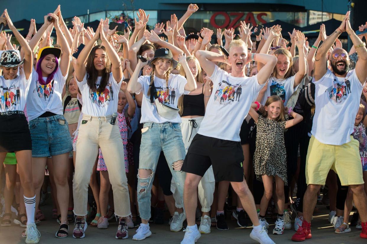 <span class="caption">Young people creating a TikTok video in Lithuania.</span> <span class="attribution"><a class="link " href="https://www.gettyimages.com/detail/news-photo/members-of-local-social-media-star-the-trending-gang-dance-news-photo/1228117350?adppopup=true" rel="nofollow noopener" target="_blank" data-ylk="slk:Photo by Alfredas Pliadis/Xinhua via Getty Images;elm:context_link;itc:0;sec:content-canvas">Photo by Alfredas Pliadis/Xinhua via Getty Images</a></span>
