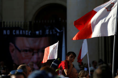 People protest against the assassination of investigative journalist Daphne Caruana Galizia last Monday, in Valletta, Malta, October 22, 2017. REUTERS/Darrin Zammit Lupi