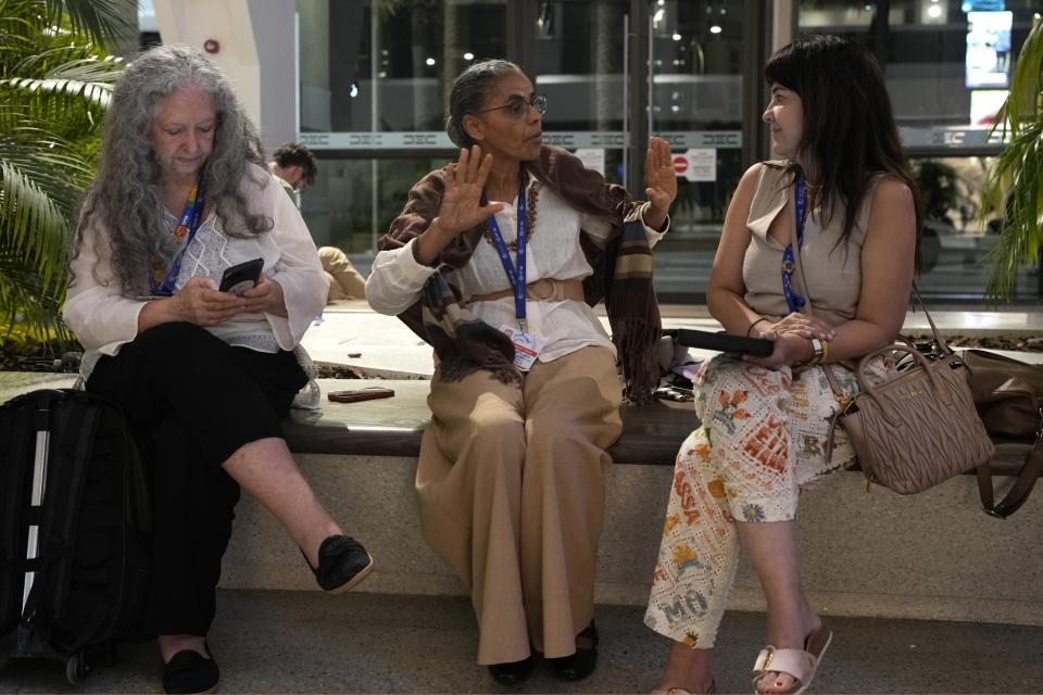 Brazilian Environment Minister Marina Silva, center, speaks after a meeting at the COP28 U.N. Climate Summit, Sunday, Dec. 10, 2023, in Dubai, United Arab Emirates. (AP Photo/Rafiq Maqbool)