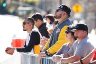 Lakers fans pay their respects across the street from the helicopter crash site of NBA star Kobe Bryant in Calabasas