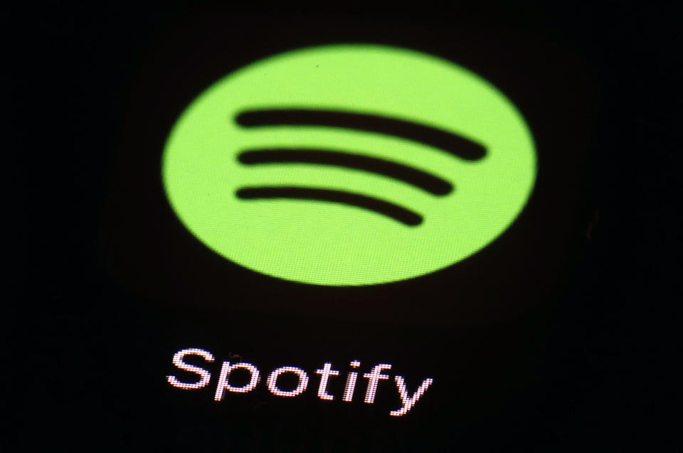 FILE- This March 20, 2018, file photo shows the Spotify app on an iPad in Baltimore. Music streaming sites Spotify and Deezer are among European tech companies and trade associations calling on EU officials to toughen proposed legislation aimed at combating unfair business practices by U.S. giants like Apple, Google and Amazon, it was reported on Tuesday, Sept. 25, 2018. (AP Photo/Patrick Semansky, File)