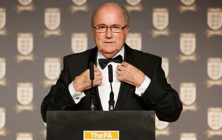 FIFA President Sepp Blatter talks on stage at The Football Association's 150th Anniversary Gala Dinner at the Grand Connaught Rooms in central London on October 26, 2013