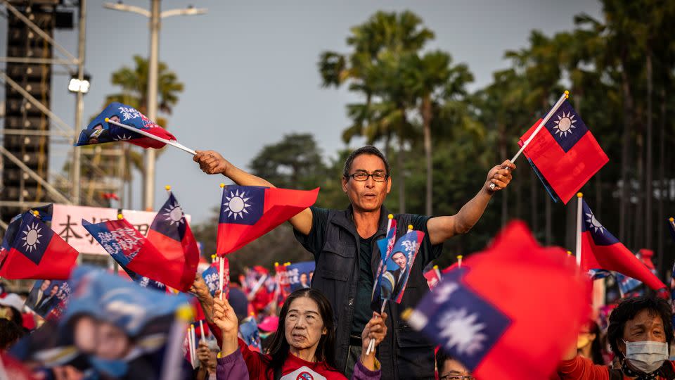 A supporter waved flags of Republic of China (ROC) during the election rally in Kaohsiung, Taiwan on Sunday afternoon, Jan 7, 2024. - Alex Chan Tsz Yuk/SIPAPRE/Sipa/AP