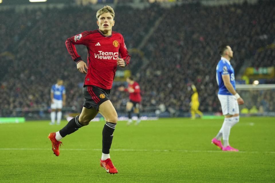 Manchester United's Alejandro Garnacho celebrates after scoring his side's first goal during the English Premier League soccer match between Everton and Manchester United, at Goodison Park Stadium, in Liverpool, England, Sunday , Nov. 26, 2023. (AP Photo/Jon Super)