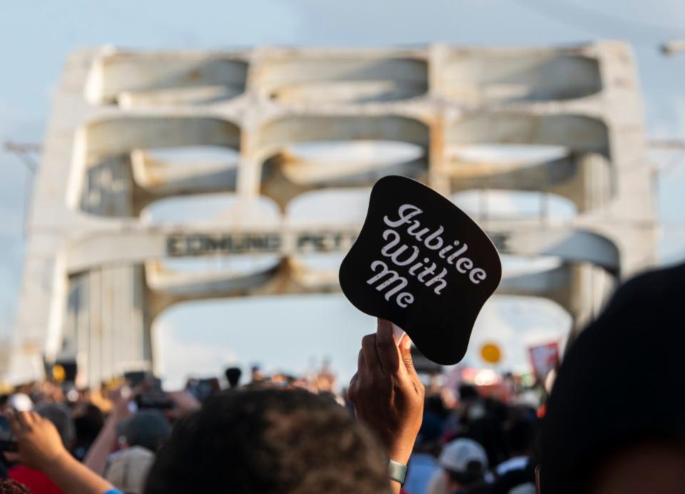 Marchers walk to the bridge on the 57th anniversary of Bloody Sunday during the Selma Jubilee at the Edmund Pettus Bridge in Selma, Ala., on Sunday, March 5, 2022.