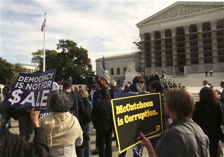 Protesters gather in front of the U.S. Supreme Court during a rally against large political donations in Washington October 8, 2013. REUTERS/Gary Cameron