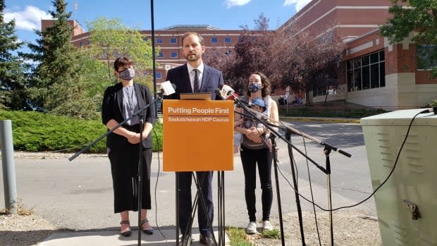 Saskatchewan's Opposition NDP Leader Ryan Meili addresses media in front of the Regina General Hospital on Tuesday. (Germain Wilson/CBC - image credit)