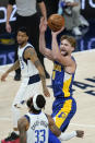 Indiana Pacers' Domantas Sabonis (11) shoots over Dallas Mavericks' Willie Cauley-Stein (33) during the first half of an NBA basketball game, Wednesday, Jan. 20, 2021, in Indianapolis. (AP Photo/Darron Cummings)