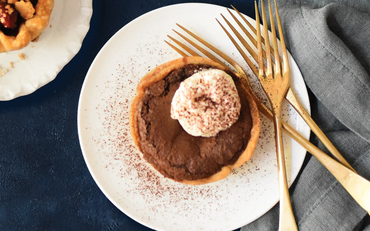 <p>Teresa Blackburn</p><p>A creamy chocolate filling goes into a store-bought pie crust.</p><p><strong>Get the recipe: <a href="https://parade.com/1294870/parade/chocolate-chess-mini-pies/" rel="nofollow noopener" target="_blank" data-ylk="slk:Chocolate Chess Mini Pies;elm:context_link;itc:0;sec:content-canvas" class="link rapid-noclick-resp">Chocolate Chess Mini Pies</a></strong></p>