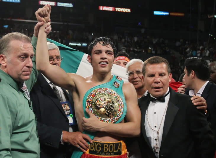 LOS ANGELES, CA - JUNE 04: (R-L) Referee Jack Reiss, Julio Cesar Chavez Jr. of Mexico and Julio Cesar Chavez Sr. of Mexico pose following the WBC World Middleweight Title bout with Sebastian Zbik of Germany at Staples Center on June 4, 2011 in Los Angeles, California. (Photo by Jeff Gross/Getty Images)