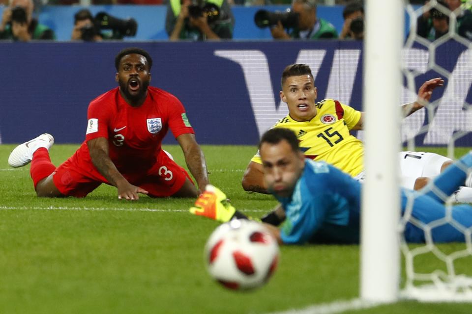 <p>England’s Danny Rose, left, reacts as Colombia’s Mateus Uribe, right, and goalkeeper David Ospina look the ball passing next to the goalpost during the round of 16 match between Colombia and England at the 2018 soccer World Cup in the Spartak Stadium, in Moscow, Russia, Tuesday, July 3, 2018. (AP Photo/Matthias Schrader) </p>