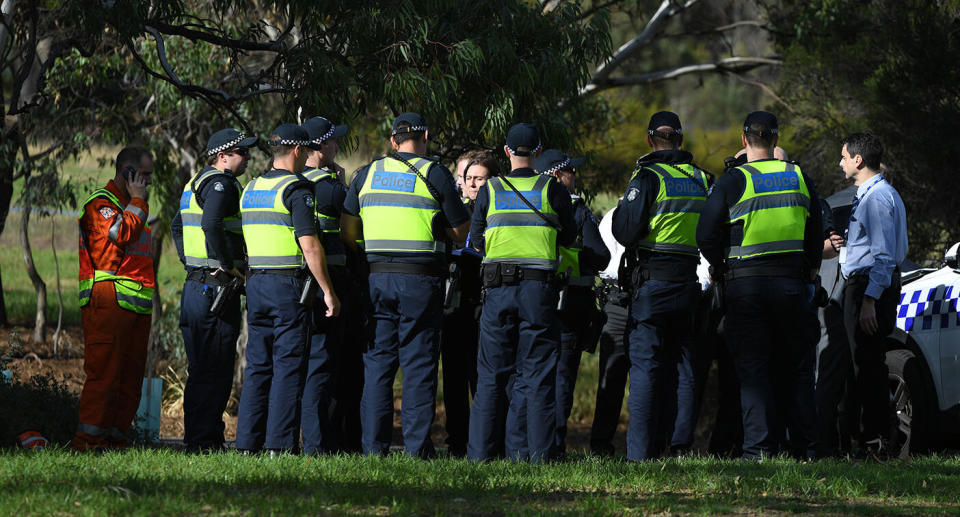 Police investigate at Royal Park, Parkville, where a woman was found dead on Saturday morning.