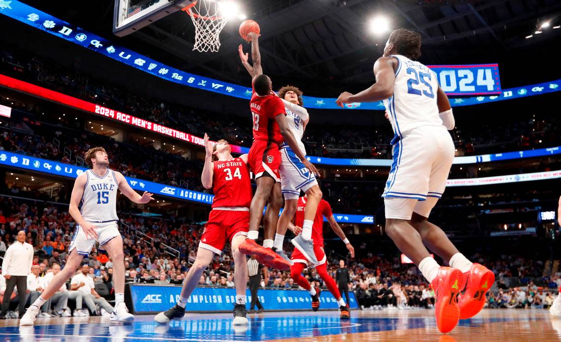 N.C. State’s Mohamed Diarra (23) blocks the shot by Duke’s Tyrese Proctor (5) during N.C. State’s 74-69 victory over Duke in the quarterfinal round of the 2024 ACC Men’s Basketball Tournament at Capital One Arena in Washington, D.C., Thursday, March 14, 2024.