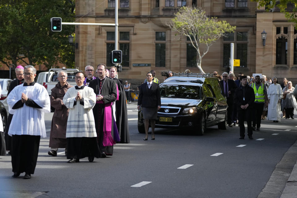 A hearse carrying the coffin of Cardinal George Pell is driven to St. Mary's Cathedral in Sydney, Wednesday, Feb. 1, 2023. Pell, who was once considered the third-highest ranking cleric in the Vatican and spent more than a year in prison before his child abuse convictions were squashed in 2020, died in Rome last month at age 81. (AP Photo/Rick Rycroft)